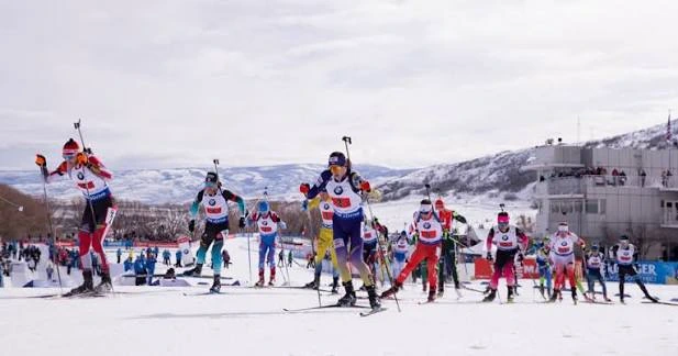 Biathletes racing uphill at Soldier Hollow